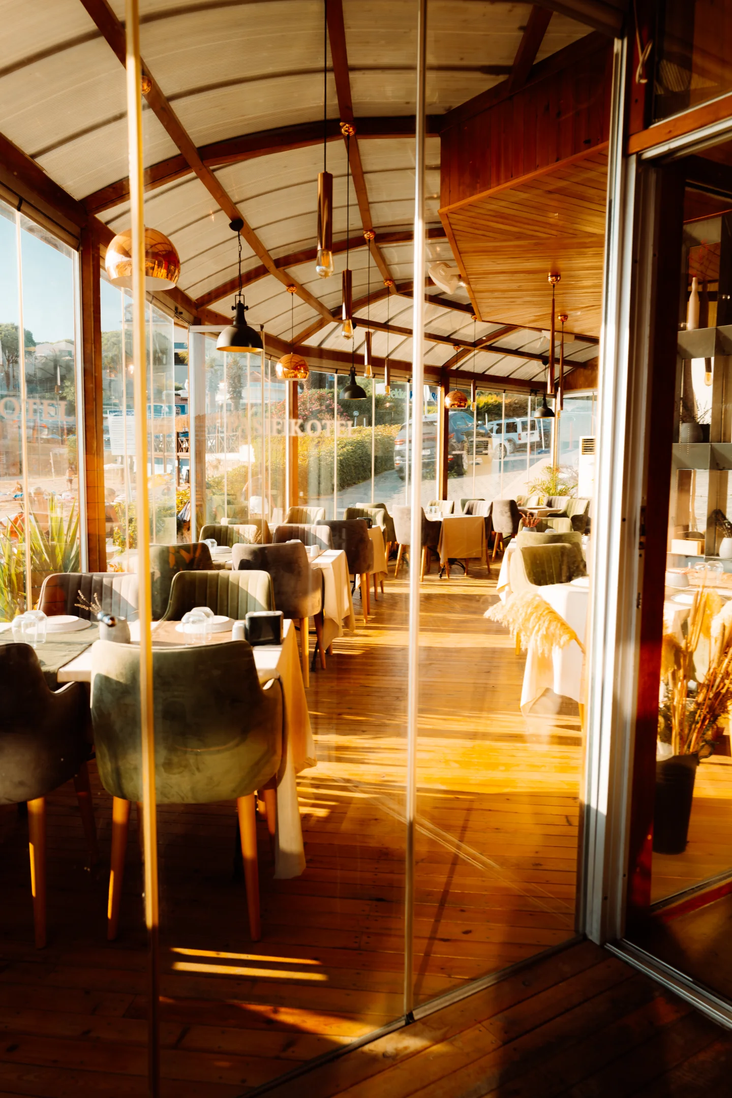 Golden restaurant interior visible through open windows.