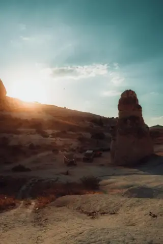 Sunburst behind a Cappadocia rock formation.