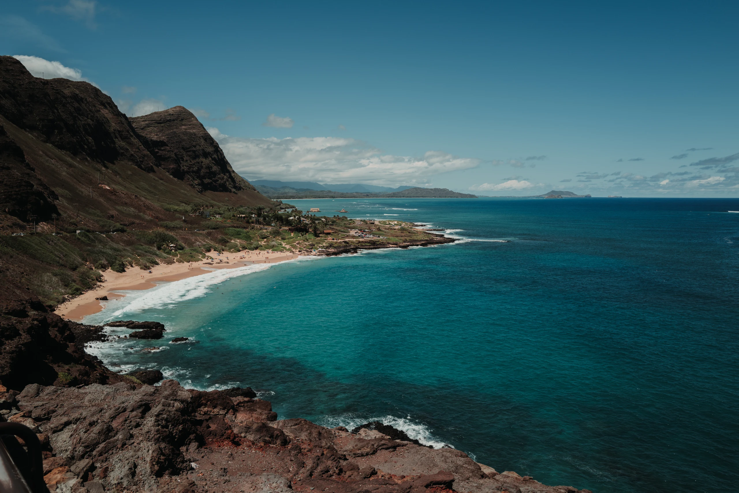 Turquoise water filling a rocky cove.
