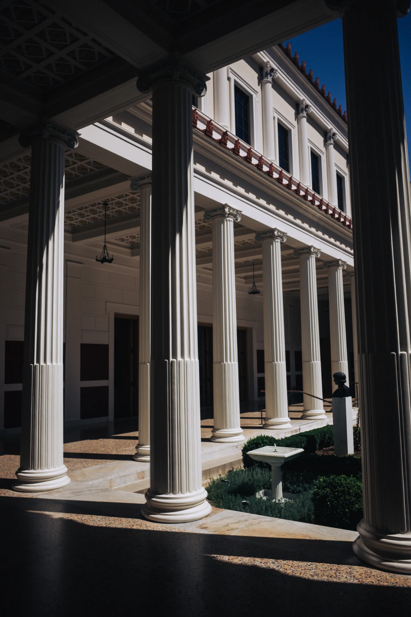White classical columns and garden courtyard at the Getty Villa