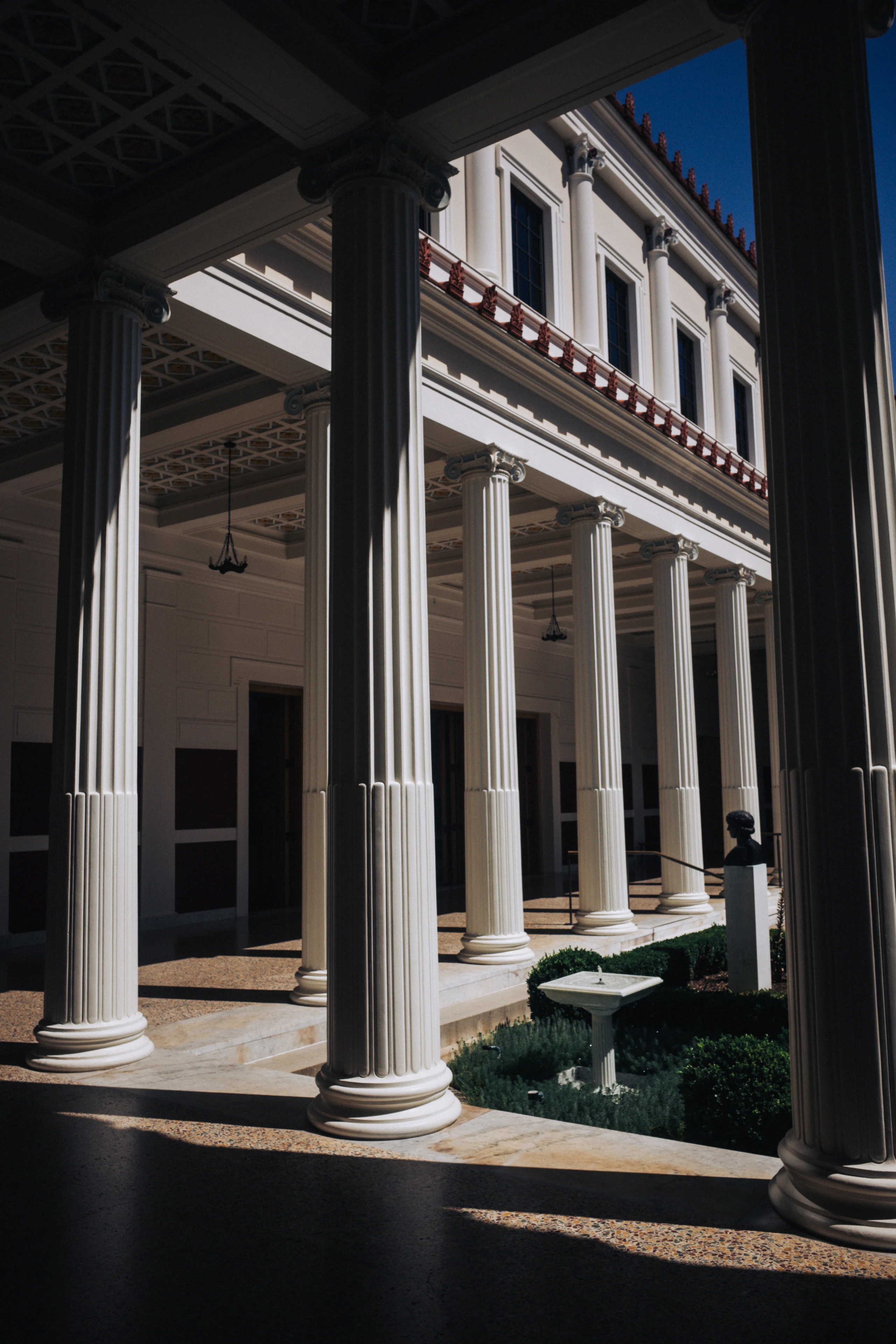White classical columns and garden courtyard at the Getty Villa