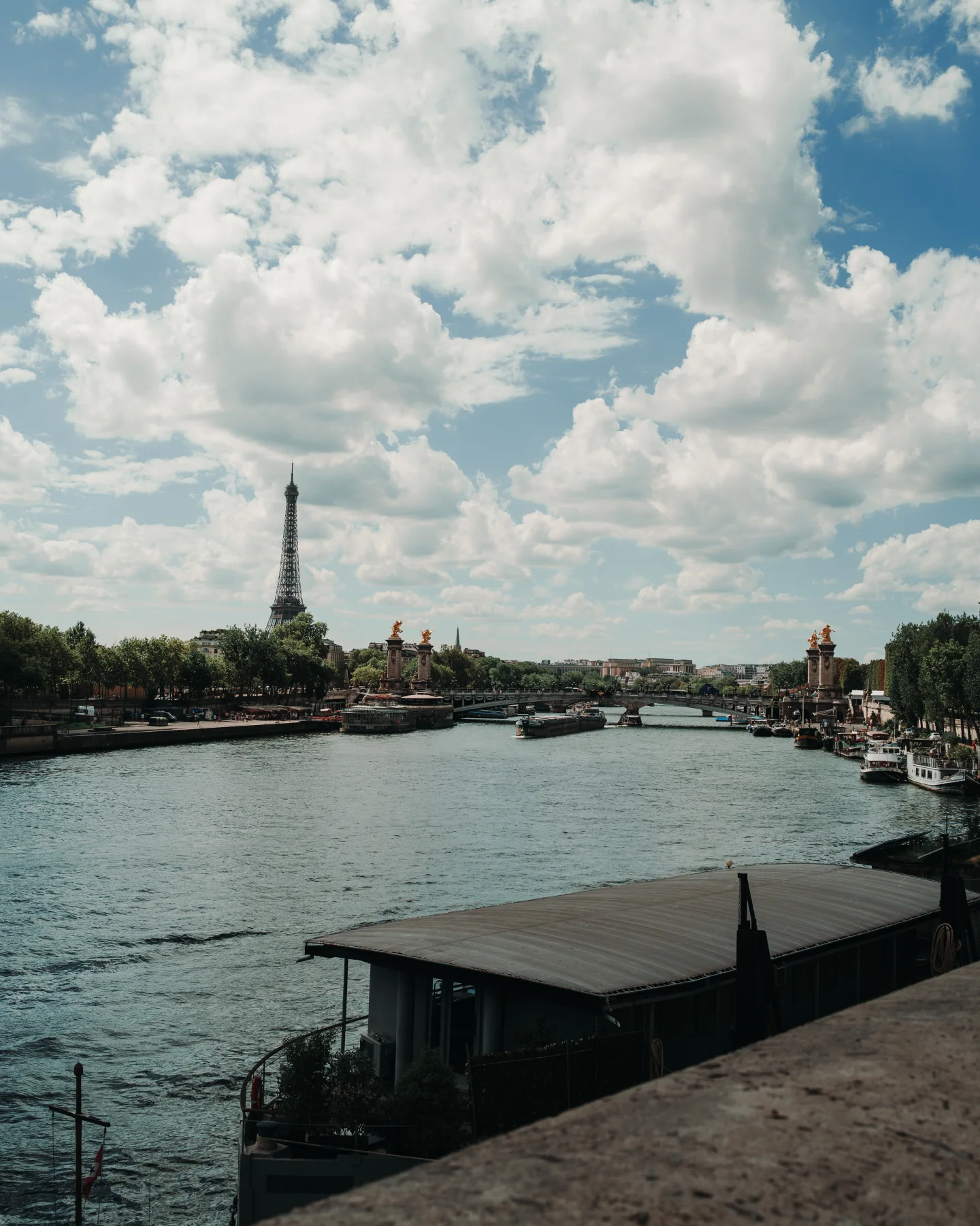 The Seine viewed from a stone embankment.