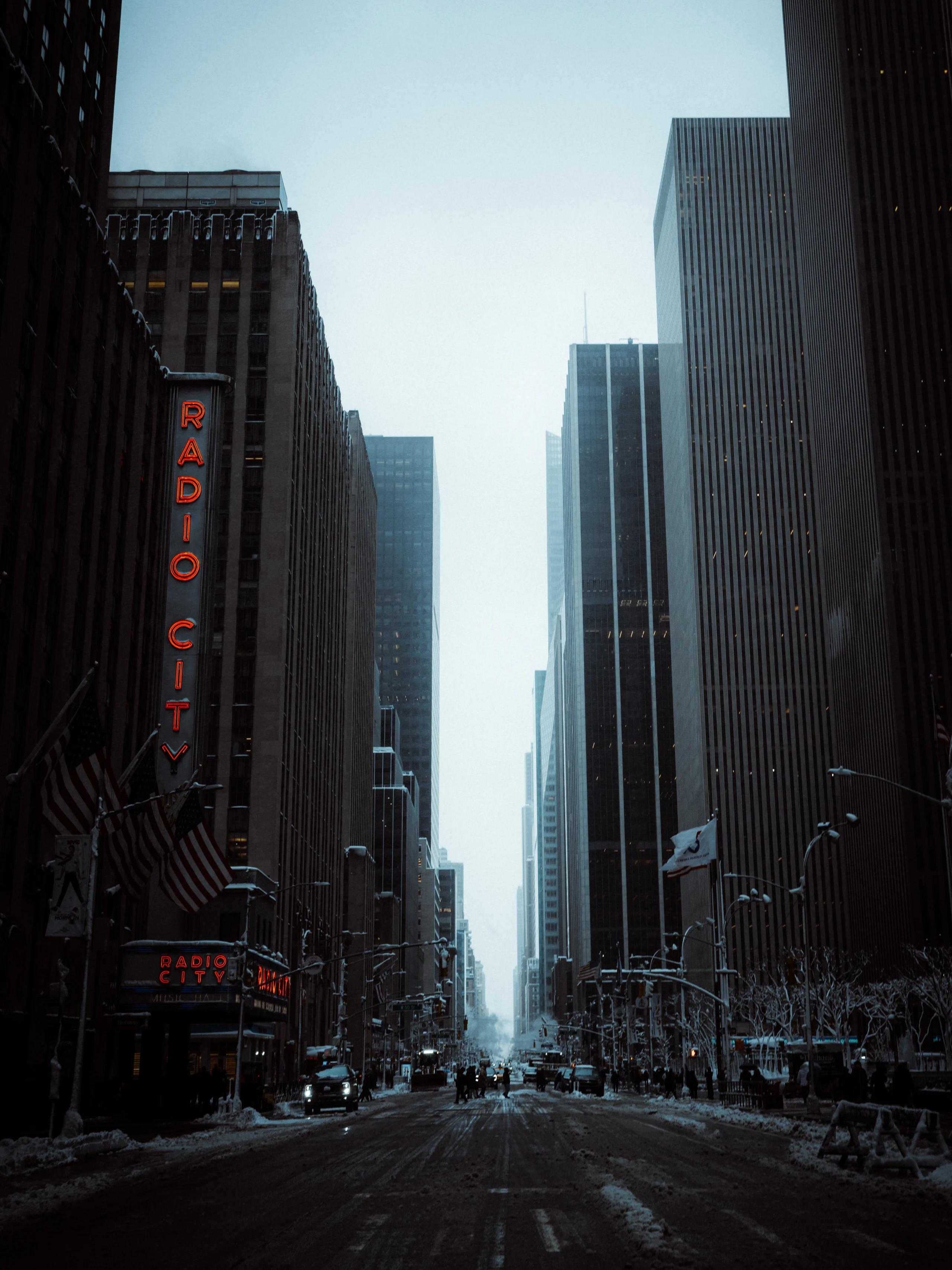 Radio City Music Hall sign above a snowy Manhattan avenue