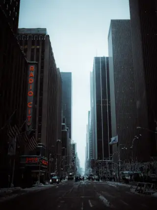Radio City Music Hall sign above a snowy Manhattan avenue